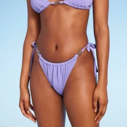 Women's Side-Tie Adjustable Extra High Leg Lurex Plisse Textured Bikini Bottom - Wild Fable™ 16 Women's Side-Tie Adjustable Extra High Leg Lurex Plisse Textured Bikini Bottom - Wild Fable™ -Thredup Fashion Shop GUEST 508e926a 58e9 4316 bb3e 4aee6aaaad19