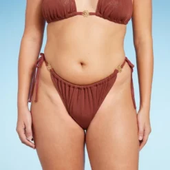 Women's Side-Tie Adjustable Extra High Leg Lurex Plisse Textured Bikini Bottom - Wild Fable™ 12 Women's Side-Tie Adjustable Extra High Leg Lurex Plisse Textured Bikini Bottom - Wild Fable™ -Thredup Fashion Shop GUEST cee21781 20fd 450e 8ef1 9194ba52deb3